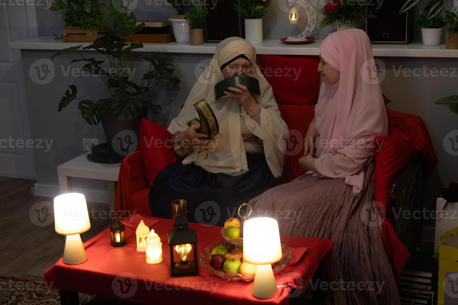 Two women sitting on a couch photo