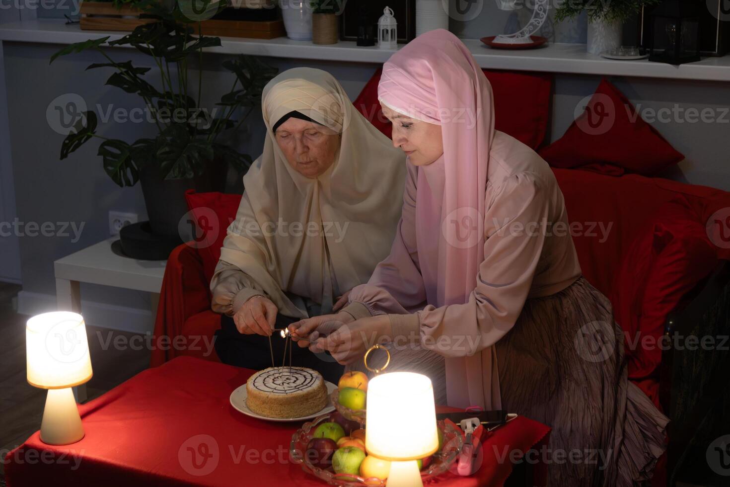 Two women sitting on a couch photo