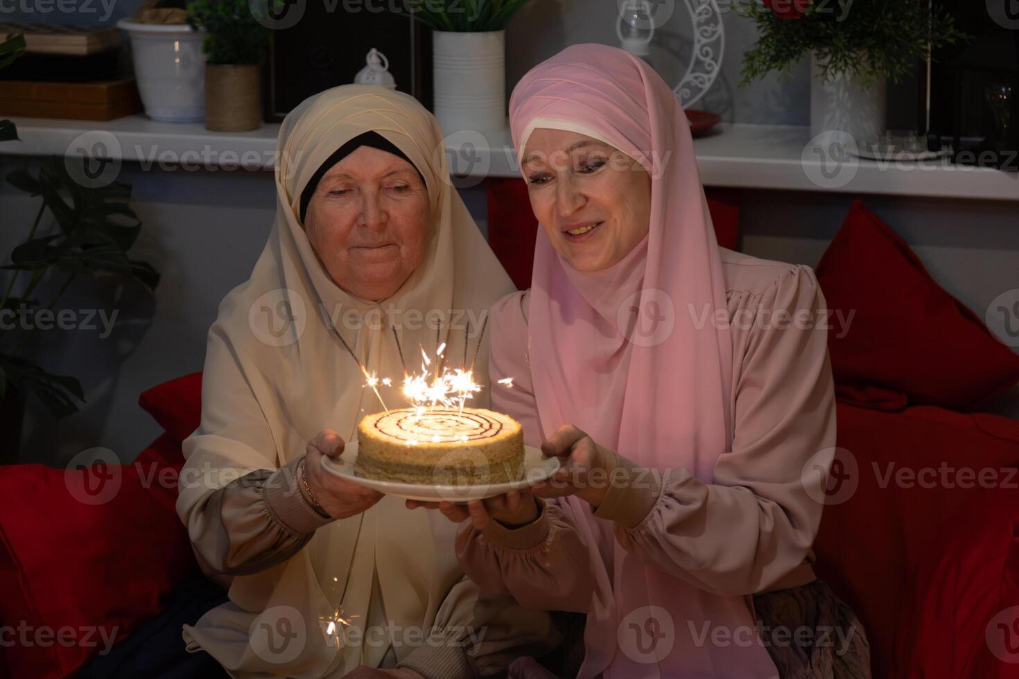 Two women sitting on a couch photo