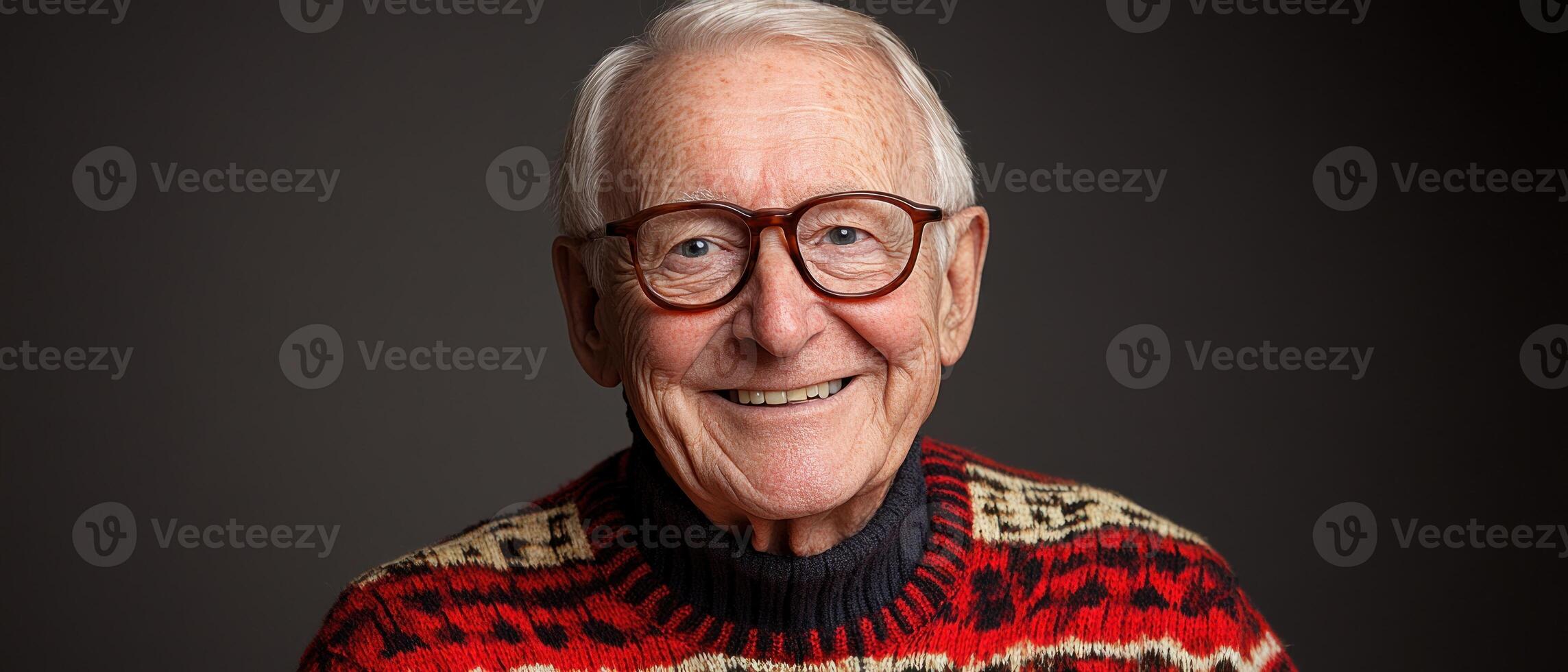 An elderly man beams with joy, showcasing his vibrant sweater in a simple setting photo