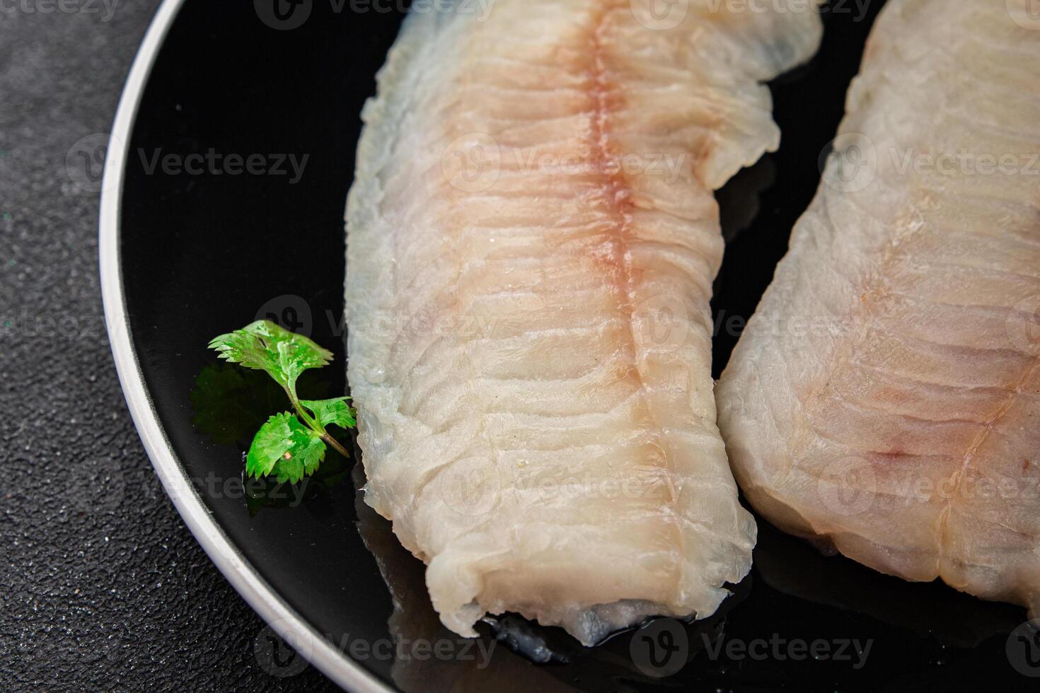Raw fish fillet fresh tasty food dish delicious gourmet food background on the table rustic food top view copy space keto and paleo diet pescetarian photo