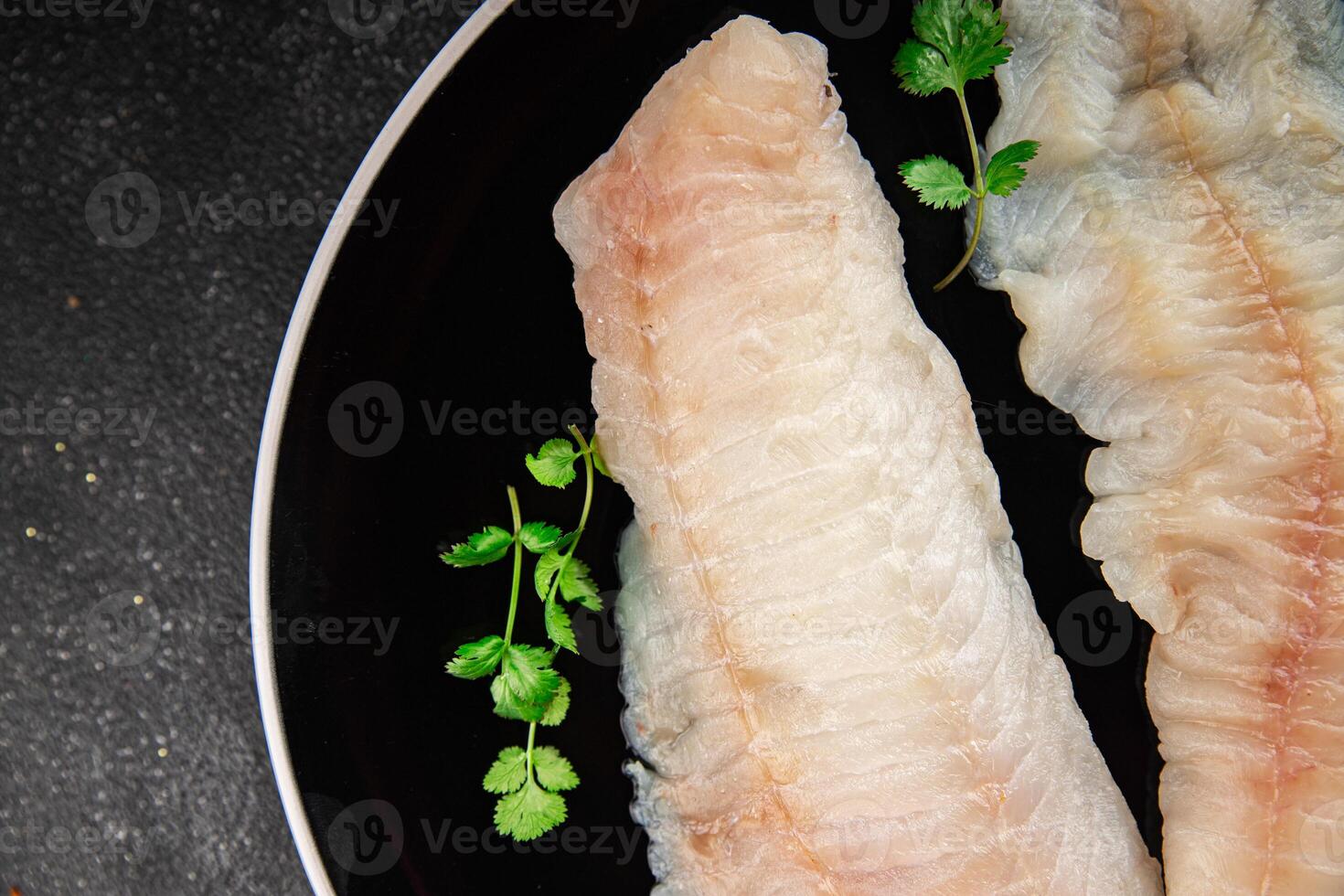 Raw fish fillet fresh tasty food dish delicious gourmet food background on the table rustic food top view copy space keto and paleo diet pescetarian photo