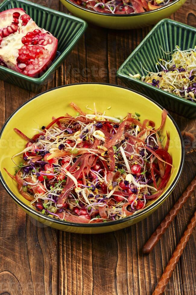 Sprouts and pomegranate salad. photo