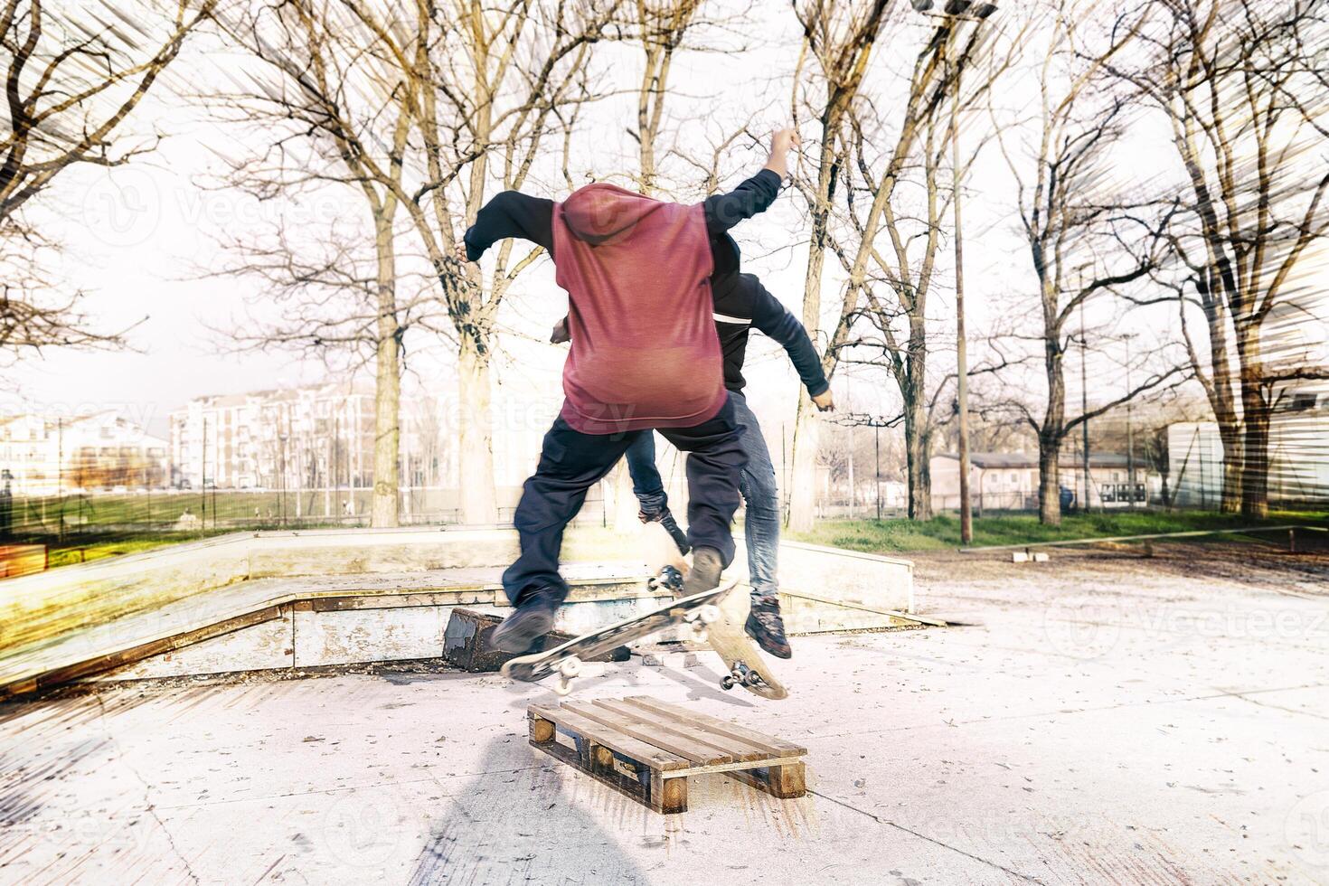 young skateboarder jumping on a ramp outdoor photo