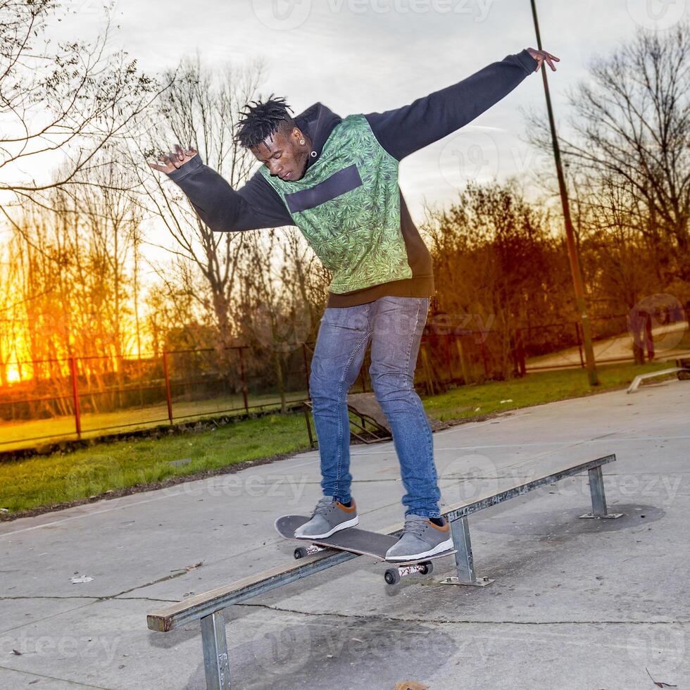 young skateboarder jumping on a ramp outdoor photo