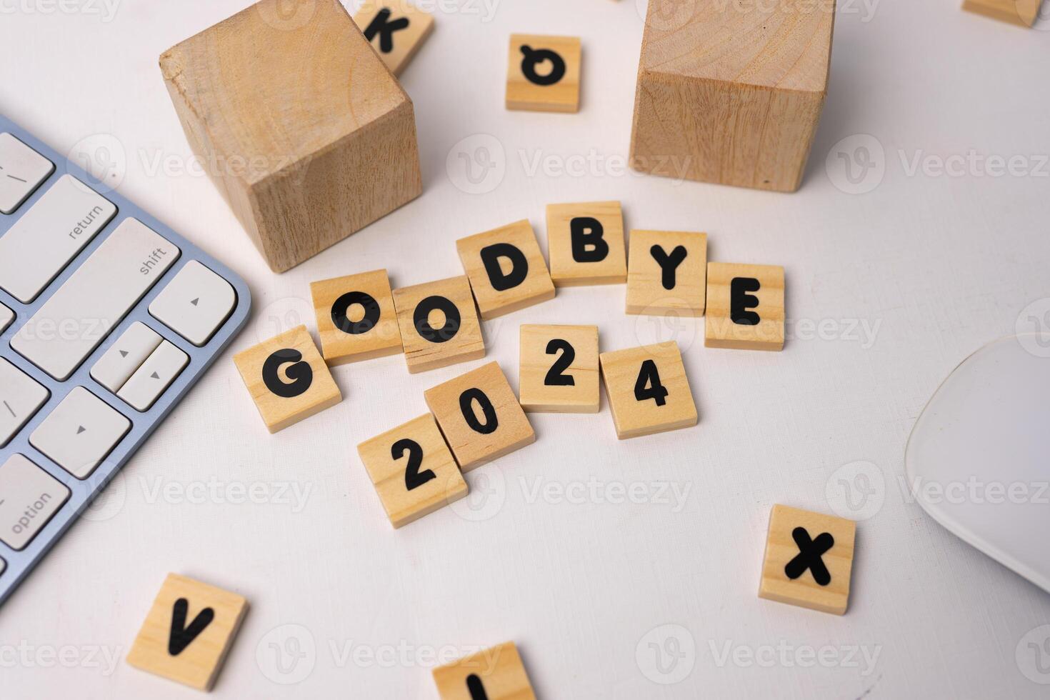 the wooden box says good bye 2024 on top of white desk with a wooden box around it photo