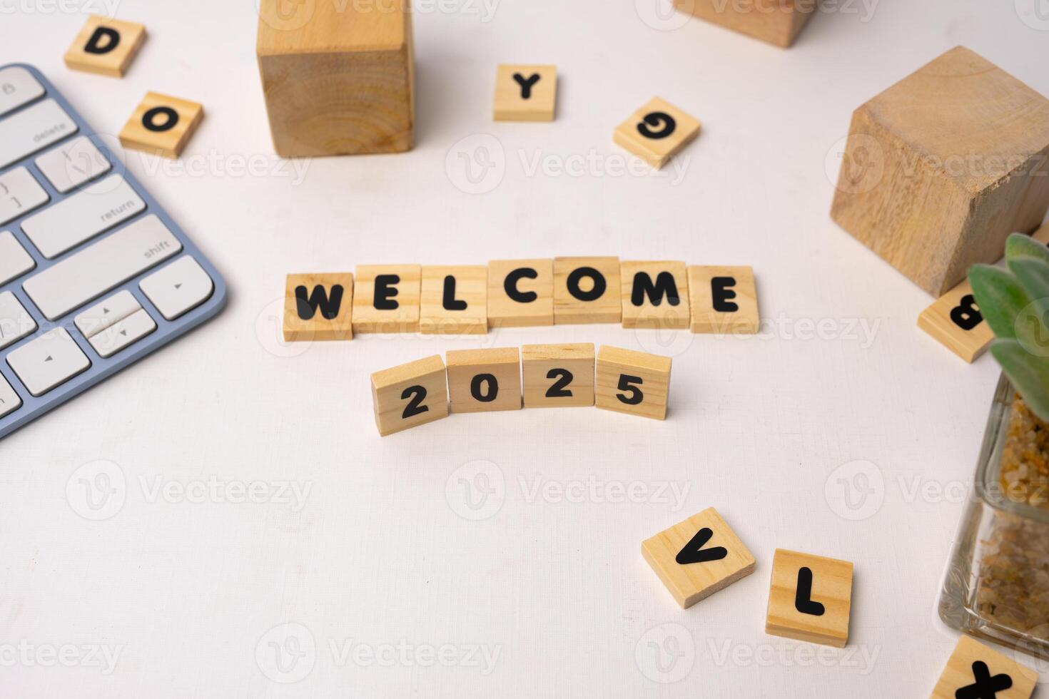 wooden blocks says welcome 2025 and another wooden blocks around it photo