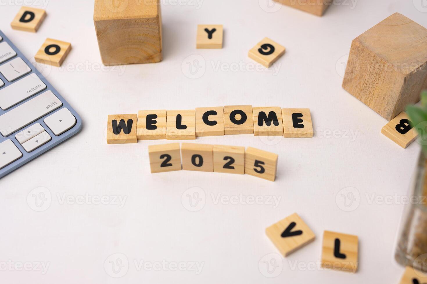 wooden blocks says welcome 2025 and another blocks around it photo
