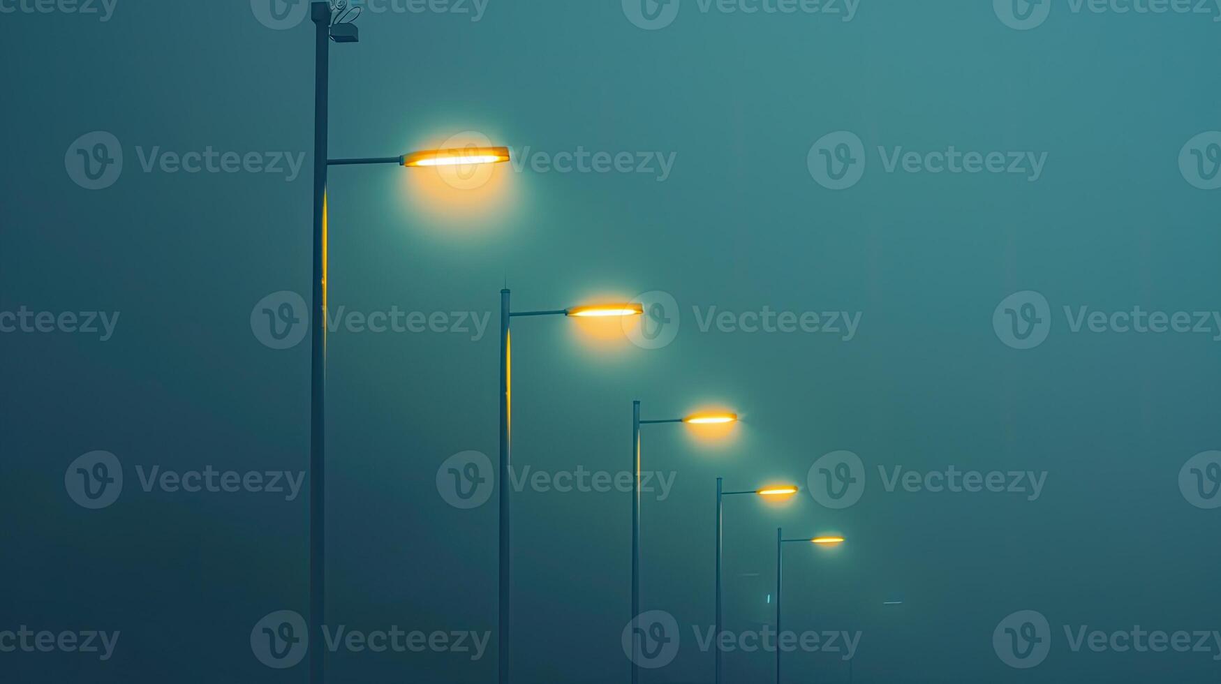 A row of street lights in the fog photo