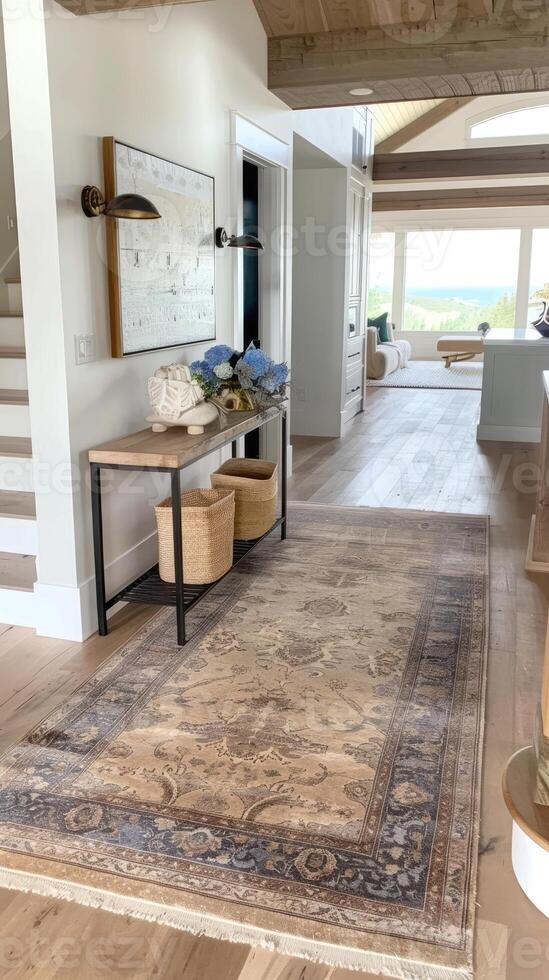 A large rug in a foyer with wooden floors photo