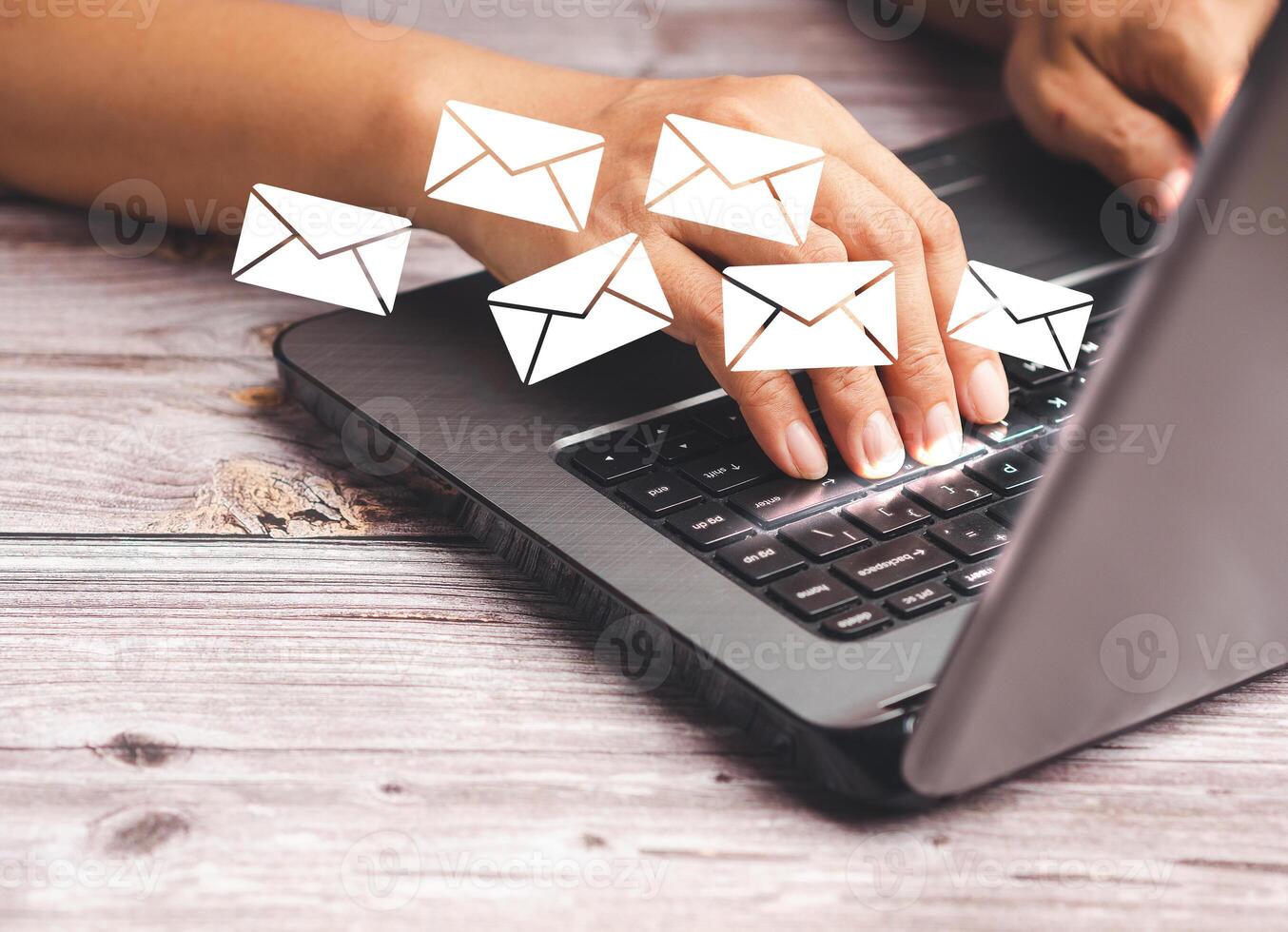 Businessman receives a new message with email icons on a virtual screen while sitting in the office photo