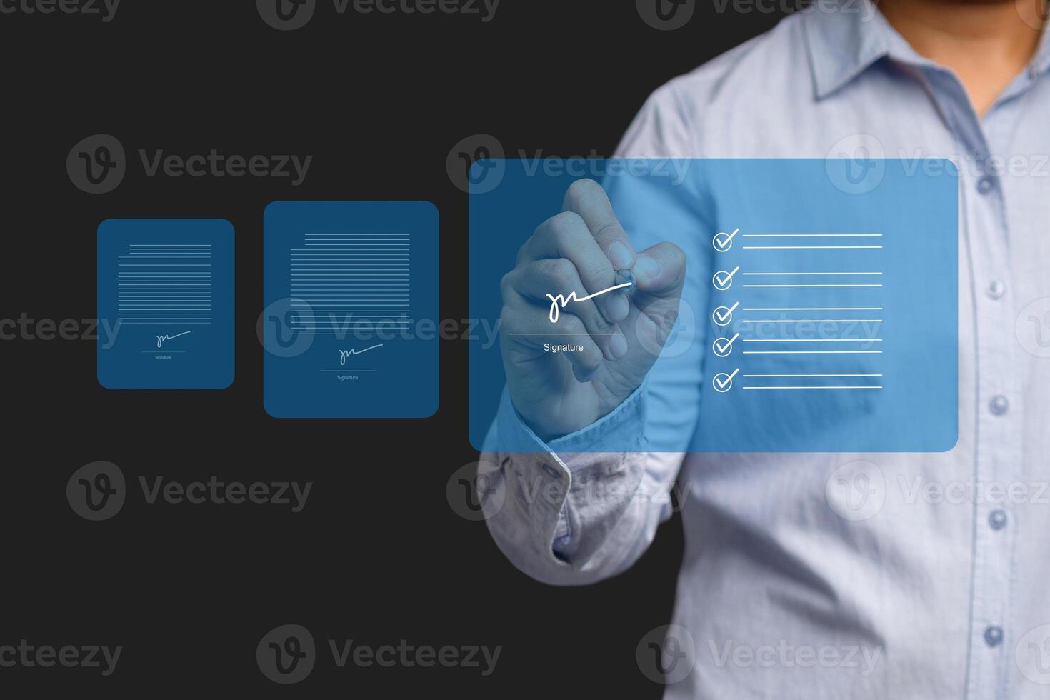 A businessman using a pen signing electronic documents on digital documents on a virtual screen photo