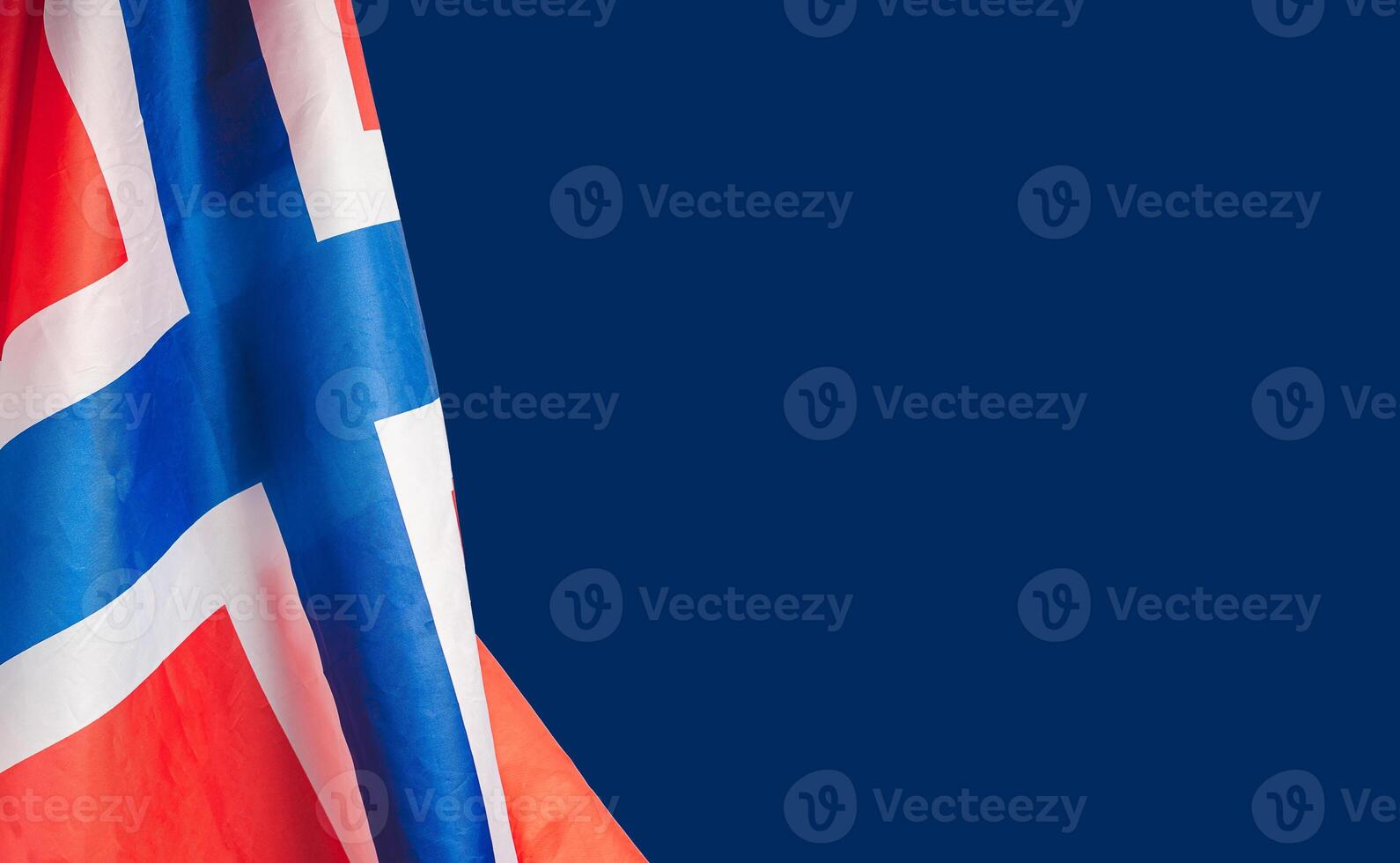 Close-up of the Norway flag on a blue background photo