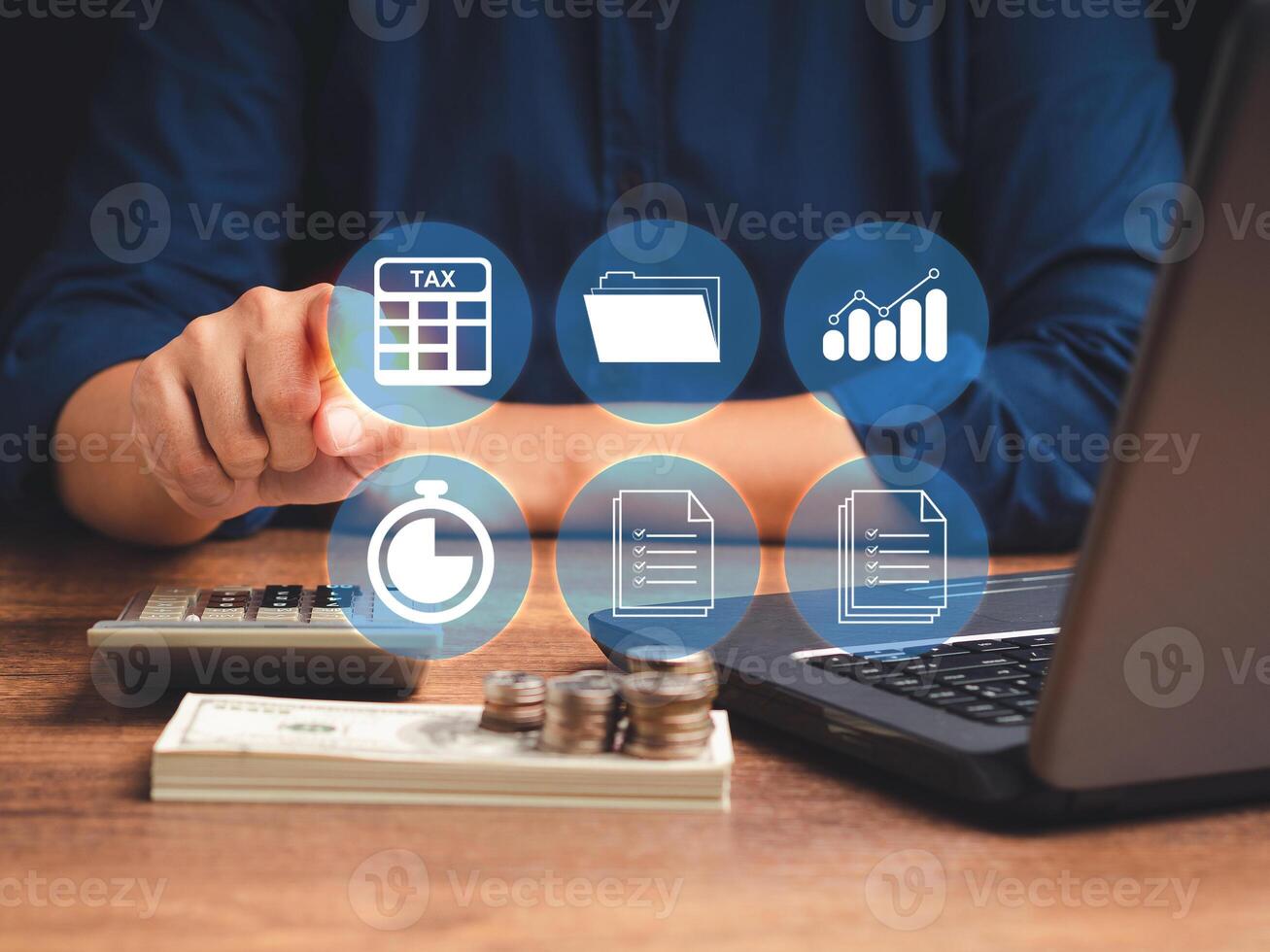 A businessman uses a tax form to complete an individual income tax payment form photo