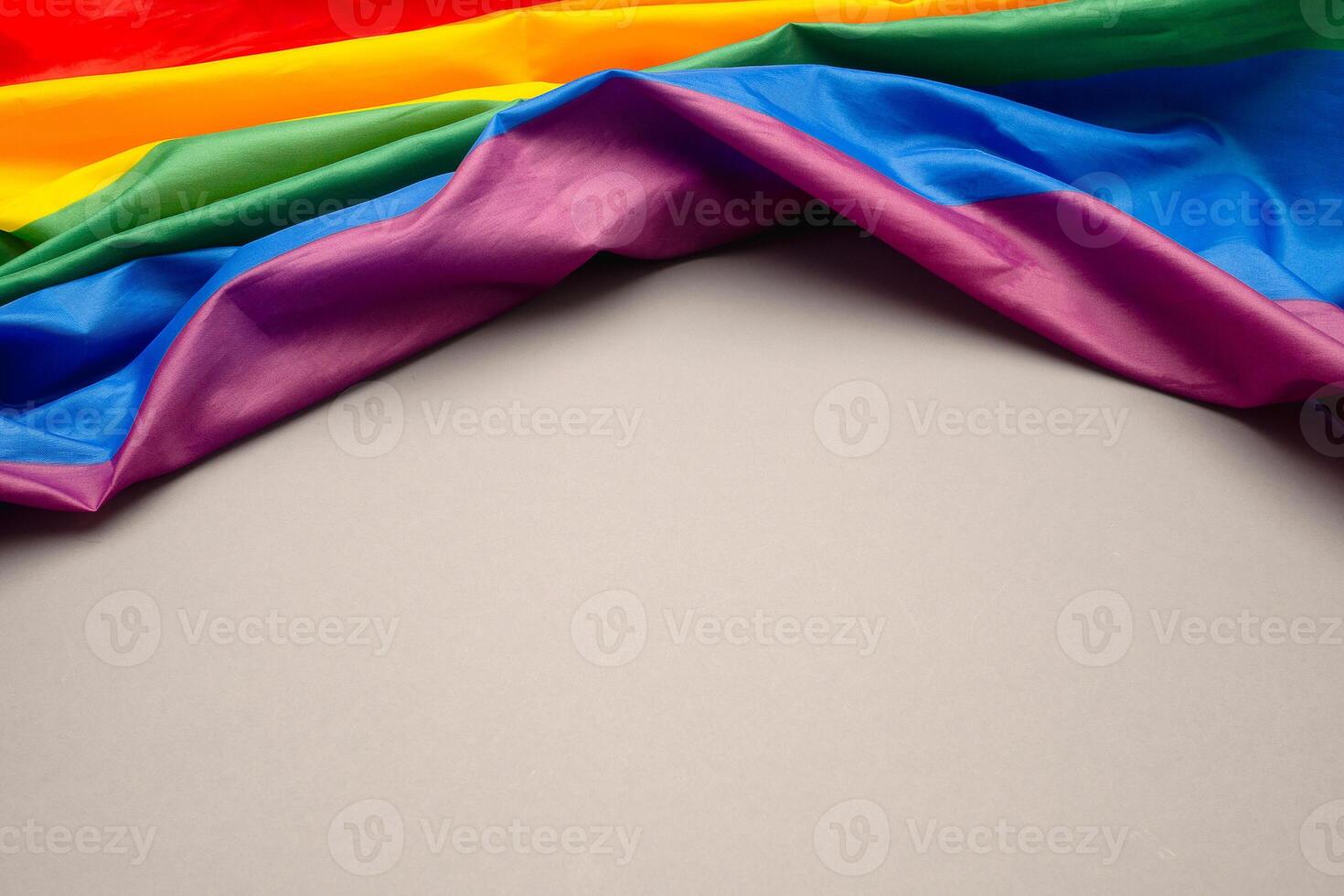 Top view of the rainbow flag or LGBT is on a gray background with copy space photo