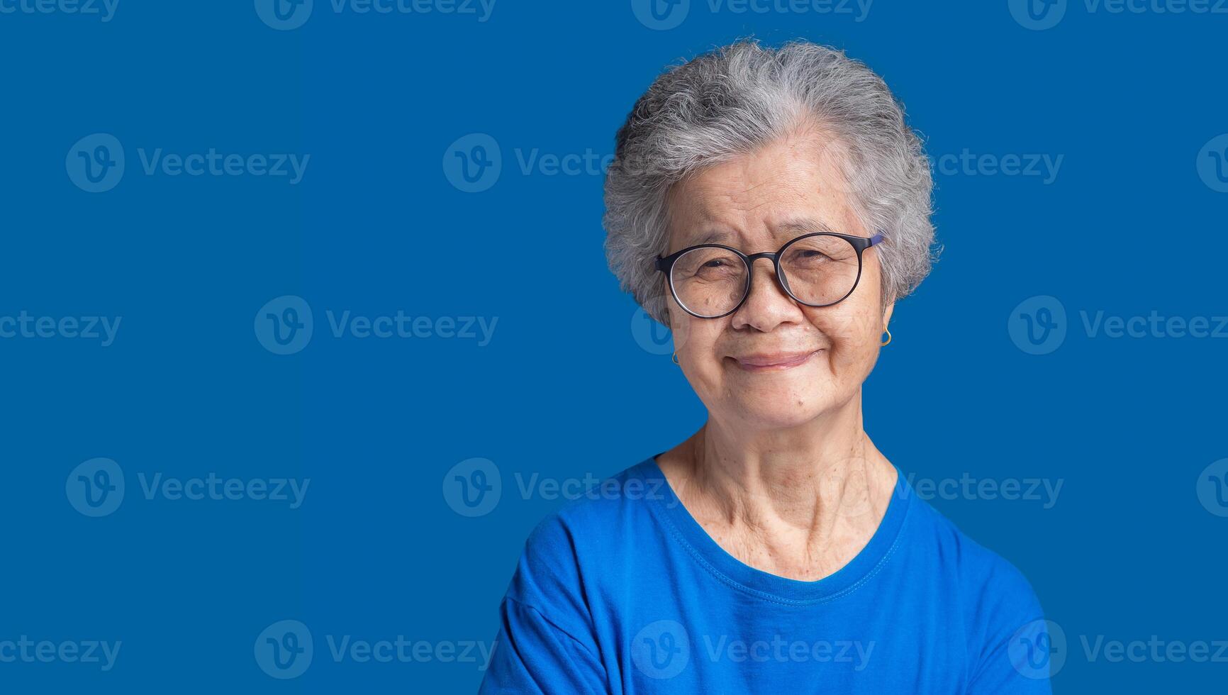 Portrait of a senior woman with short gray hair looking at the camera with a smile photo