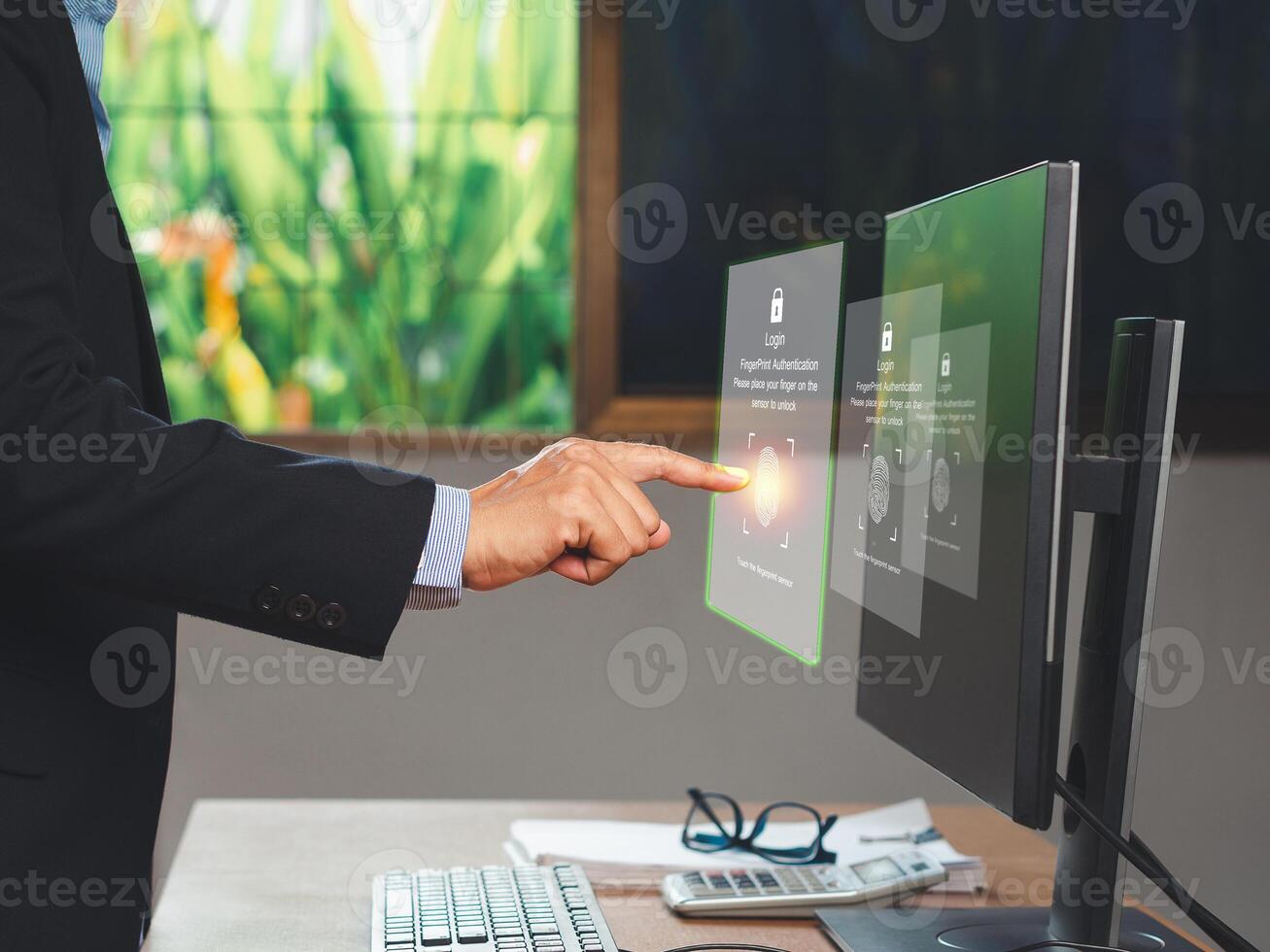 businessman-login-to-the-system-by-fingerprint-on-a-virtual-screen-while-standing-in-the-office-photo.jpg