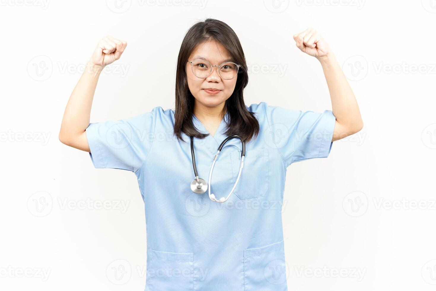 Showing Strength Arms Of Asian Young Doctor Isolated On White Background photo