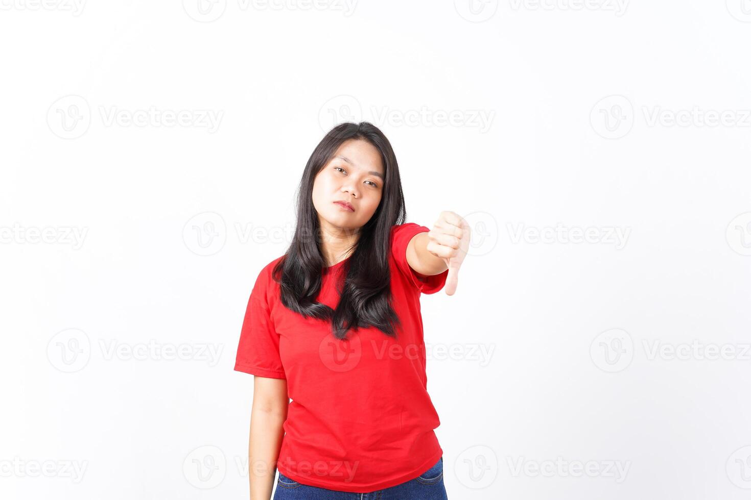 Showing Thumb Down, Dislike Concept Of Beautiful Asian Woman Wearing Red Shirt Isolated On White Background photo