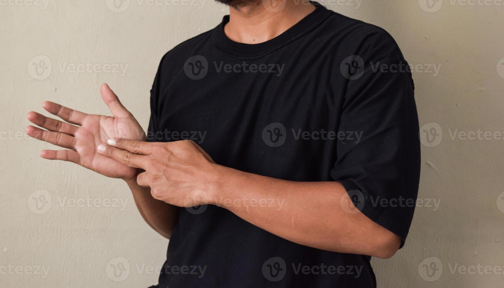 Raised man's hands being raised while showing word train using language of deaf people photo