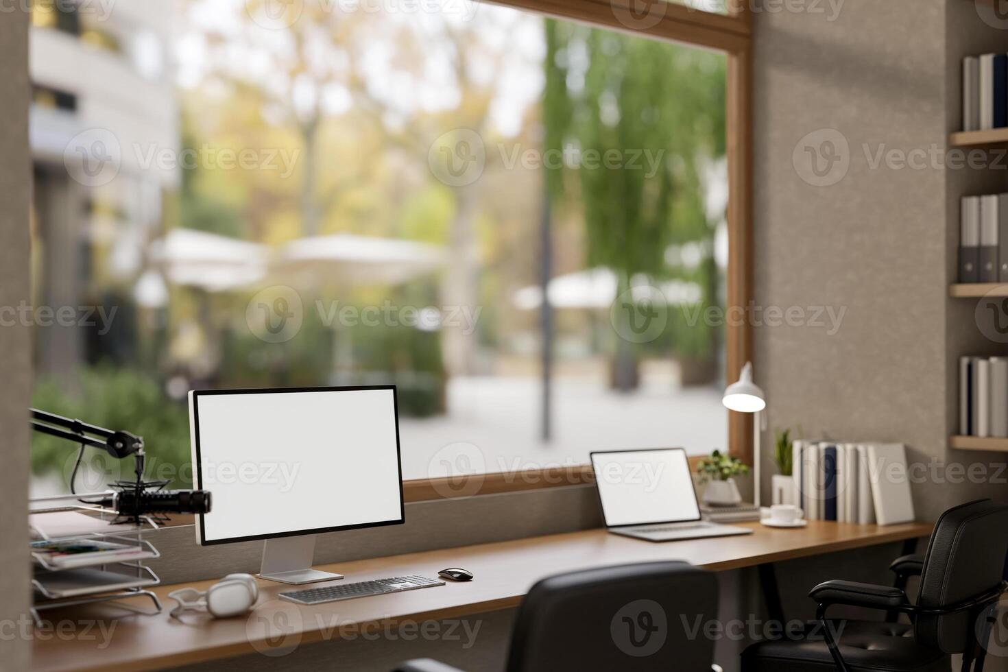 A modern, minimalist radio podcast office featuring a computer and a laptop mockups and a microphone photo