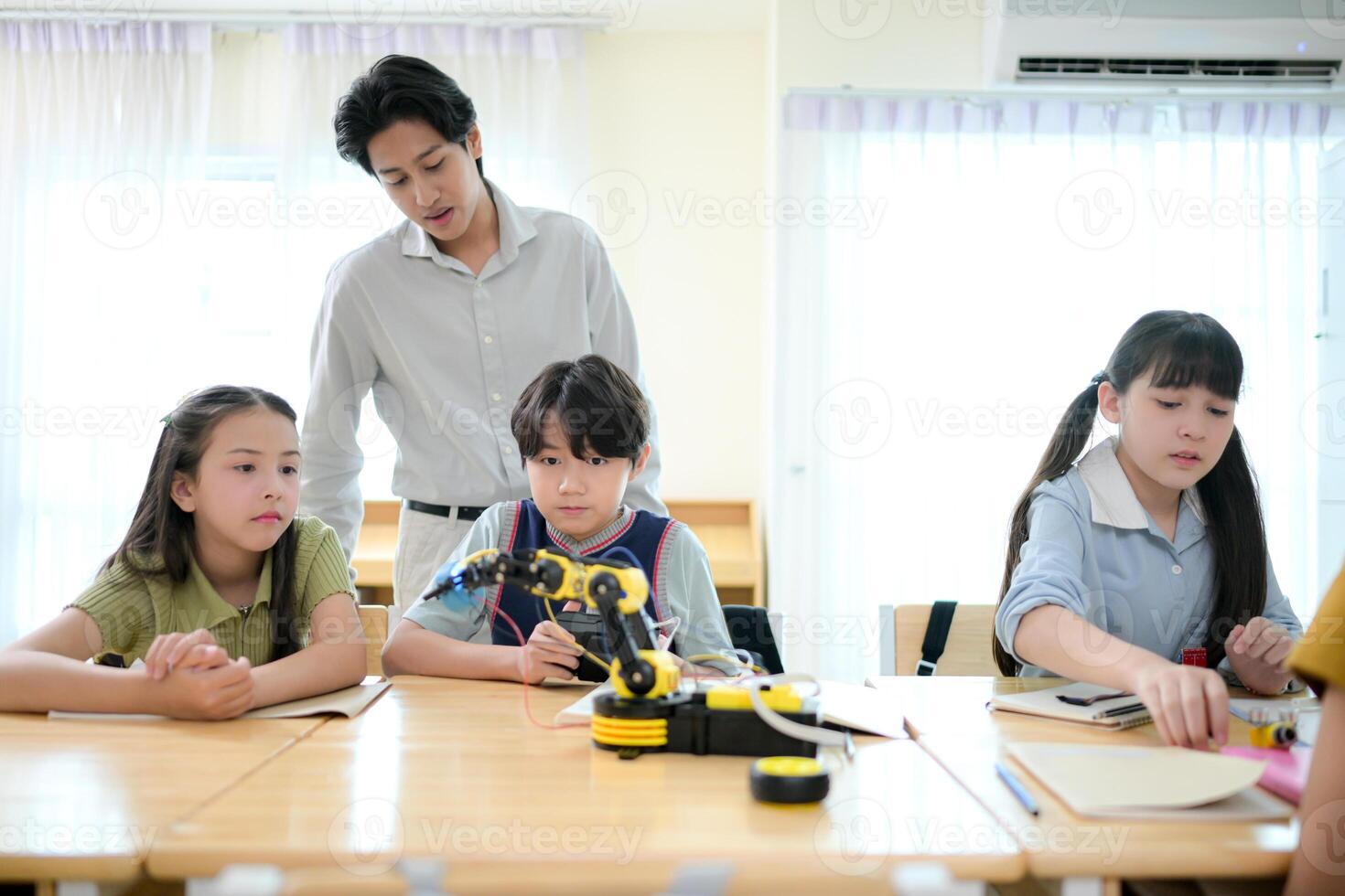 STEM Class, Teacher and students in basic engineering classroom photo