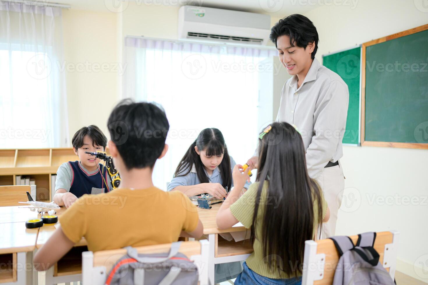 STEM Class, Teacher and students in basic engineering classroom photo