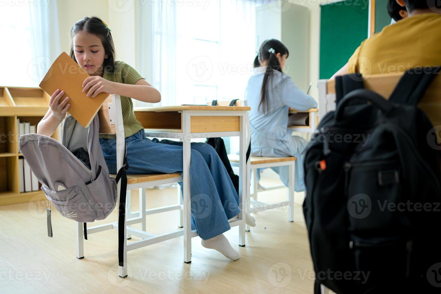 A schoolchild with his rucksack to store vital stuff for class photo