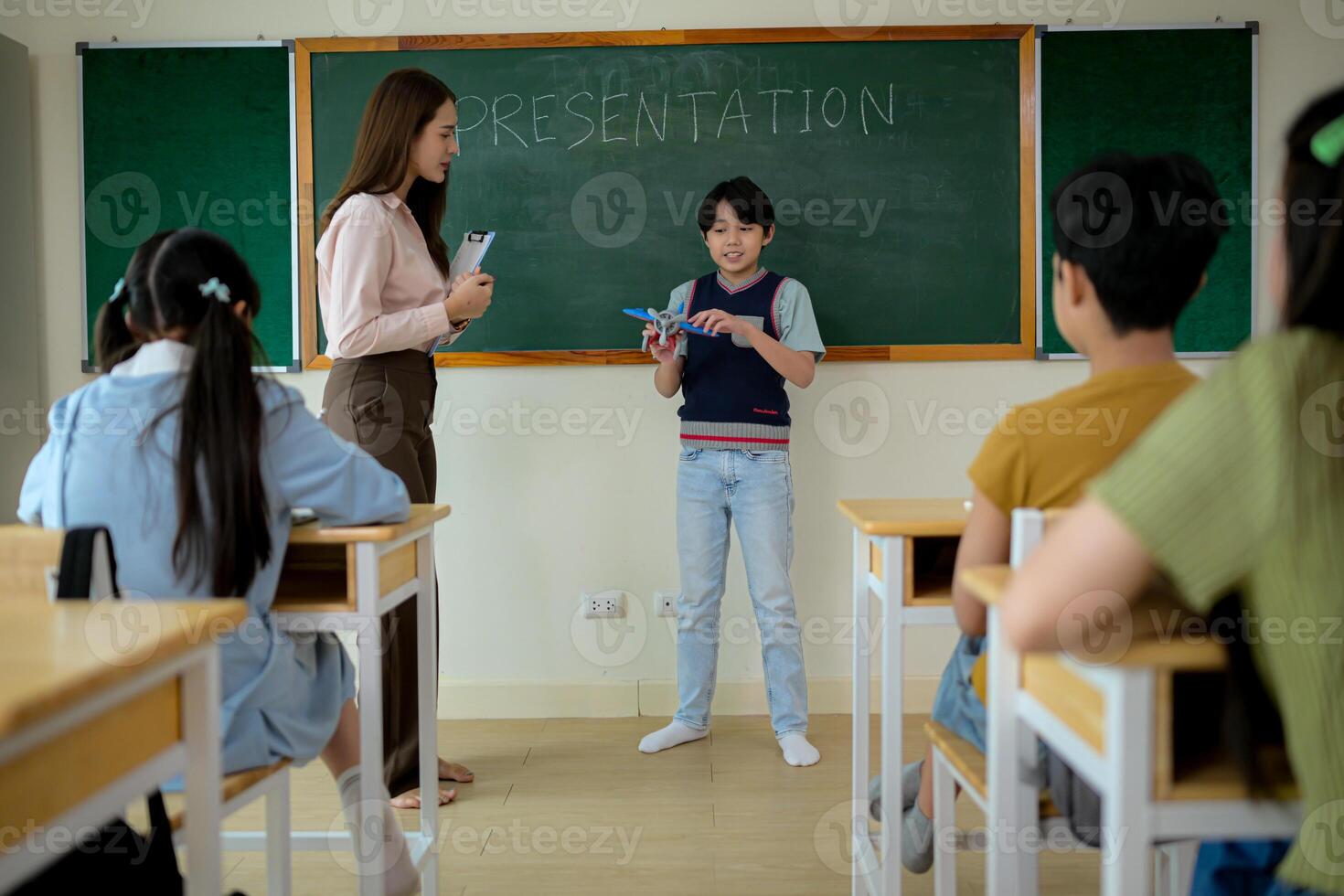 Presentation lesson, Teacher and students in the basic presentation in front of class photo