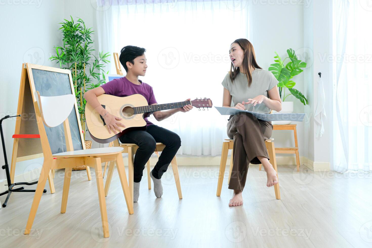 Guitar Class, Teacher and students in music classroom photo