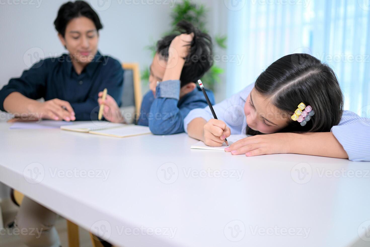 Small class, Teacher and pupils in the home classroom, reviewing lessons and offering homework advice photo