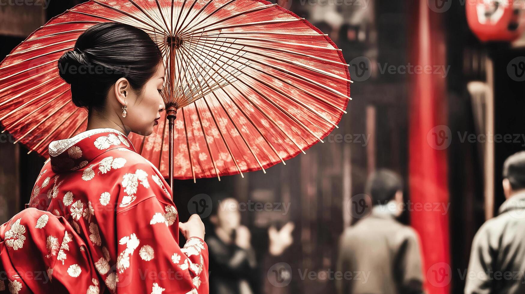 A woman in a kimono holding an umbrella photo