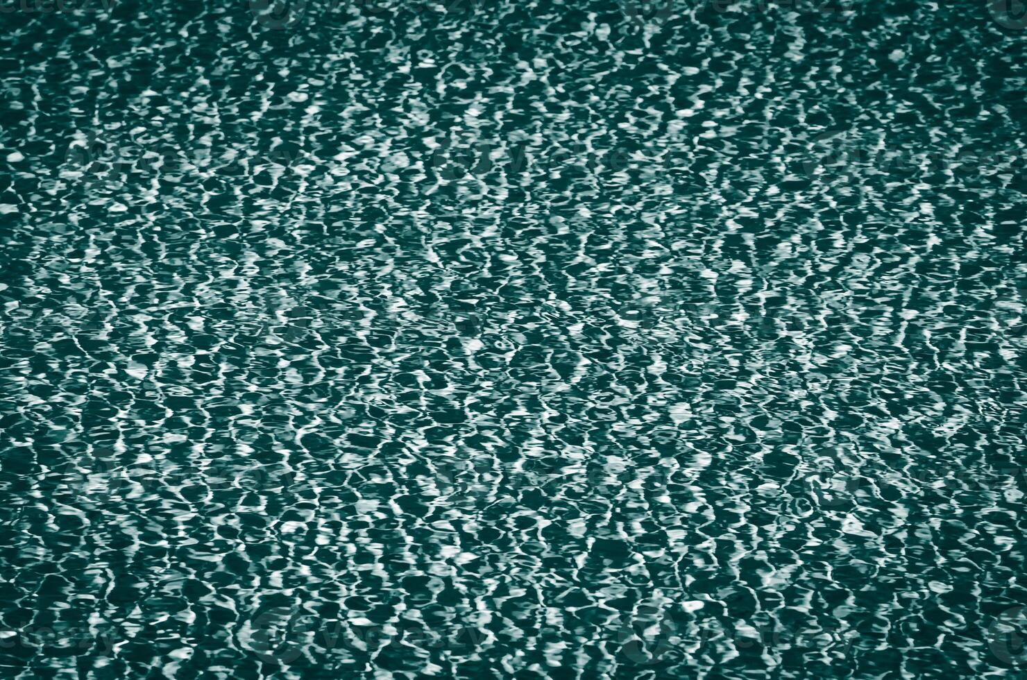 Transparent water background dark teal color toned photo