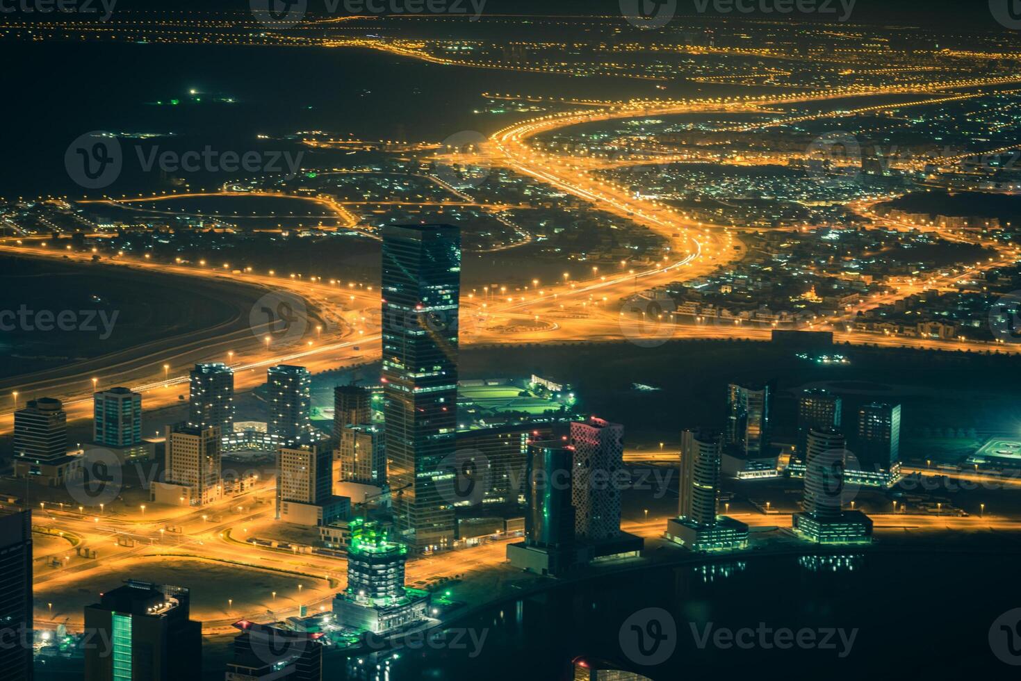 Dubai downtown night scene with city lights. Top view photo