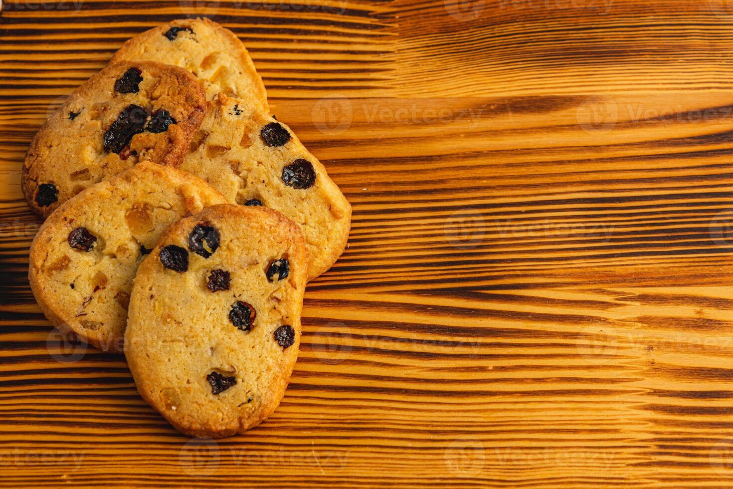 Festive homemade cookies with raisins on a wooden table photo