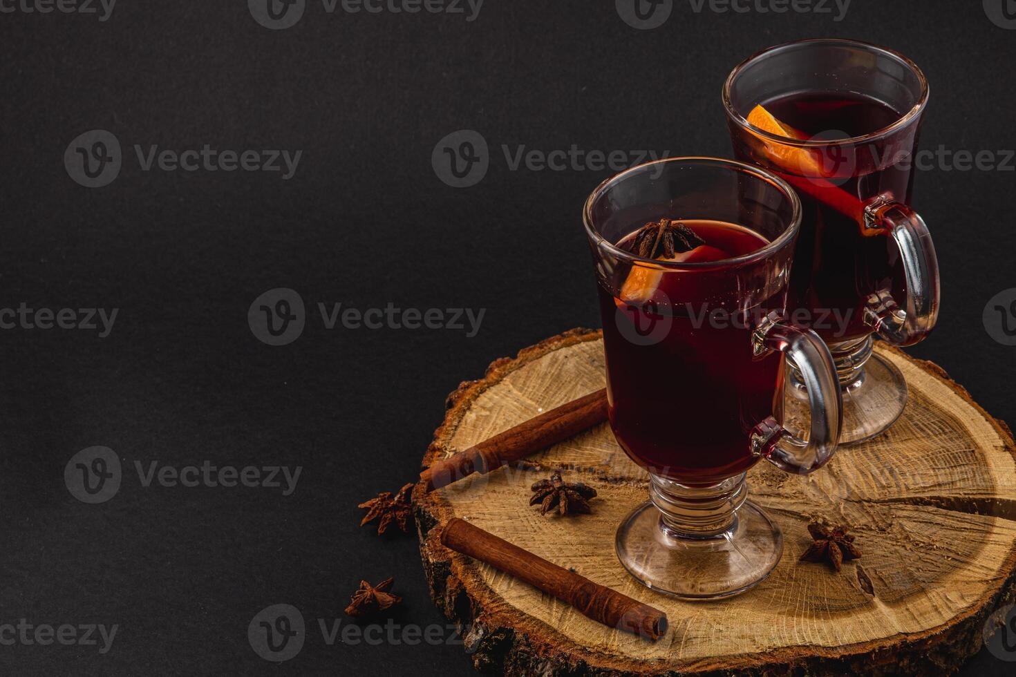 Warm fresh mulled wine with spices for a festive winter evening photo
