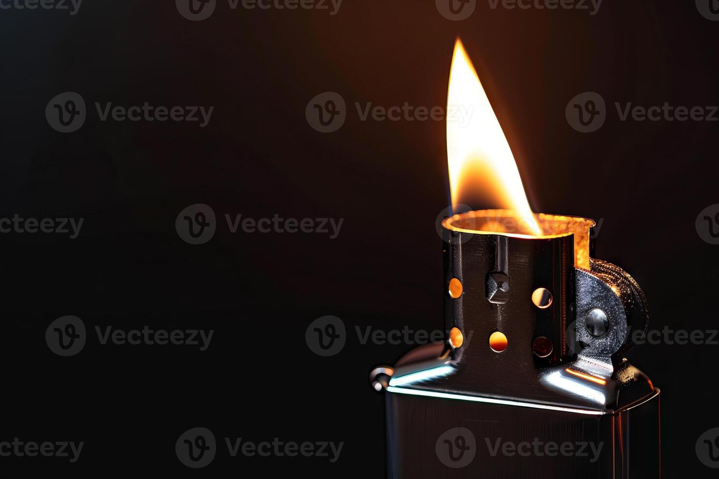 Close-Up of a Hand Lighting a Zippo Lighter Against a Black Background. Concept of Fire, Ignition, and Metal Craftsmanship. Copy space photo