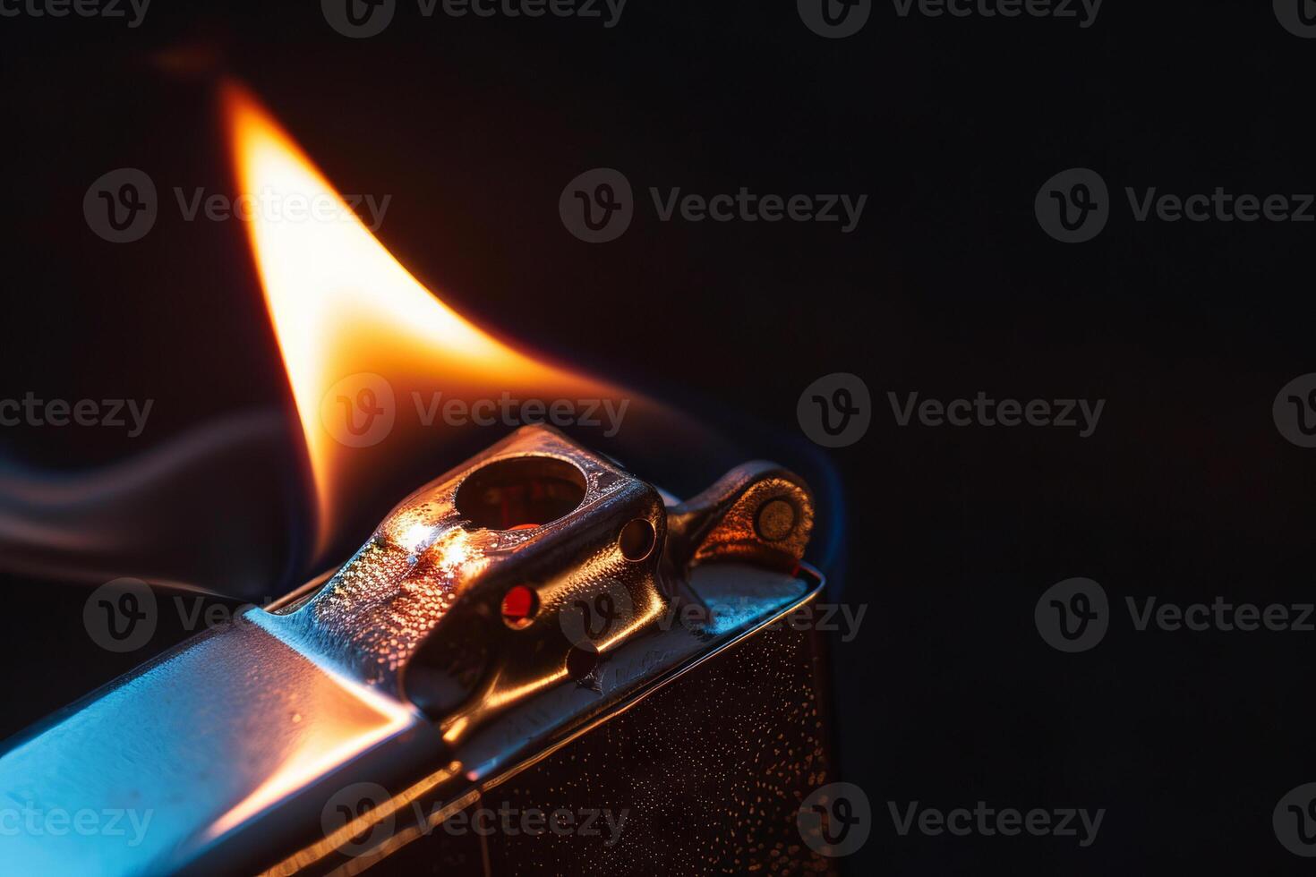 Janalyso Lighting a Zippo Close-Up on Dark Black Background. Concept of Handheld Firestarters, Vintage Collectibles, and Urban Aesthetics photo