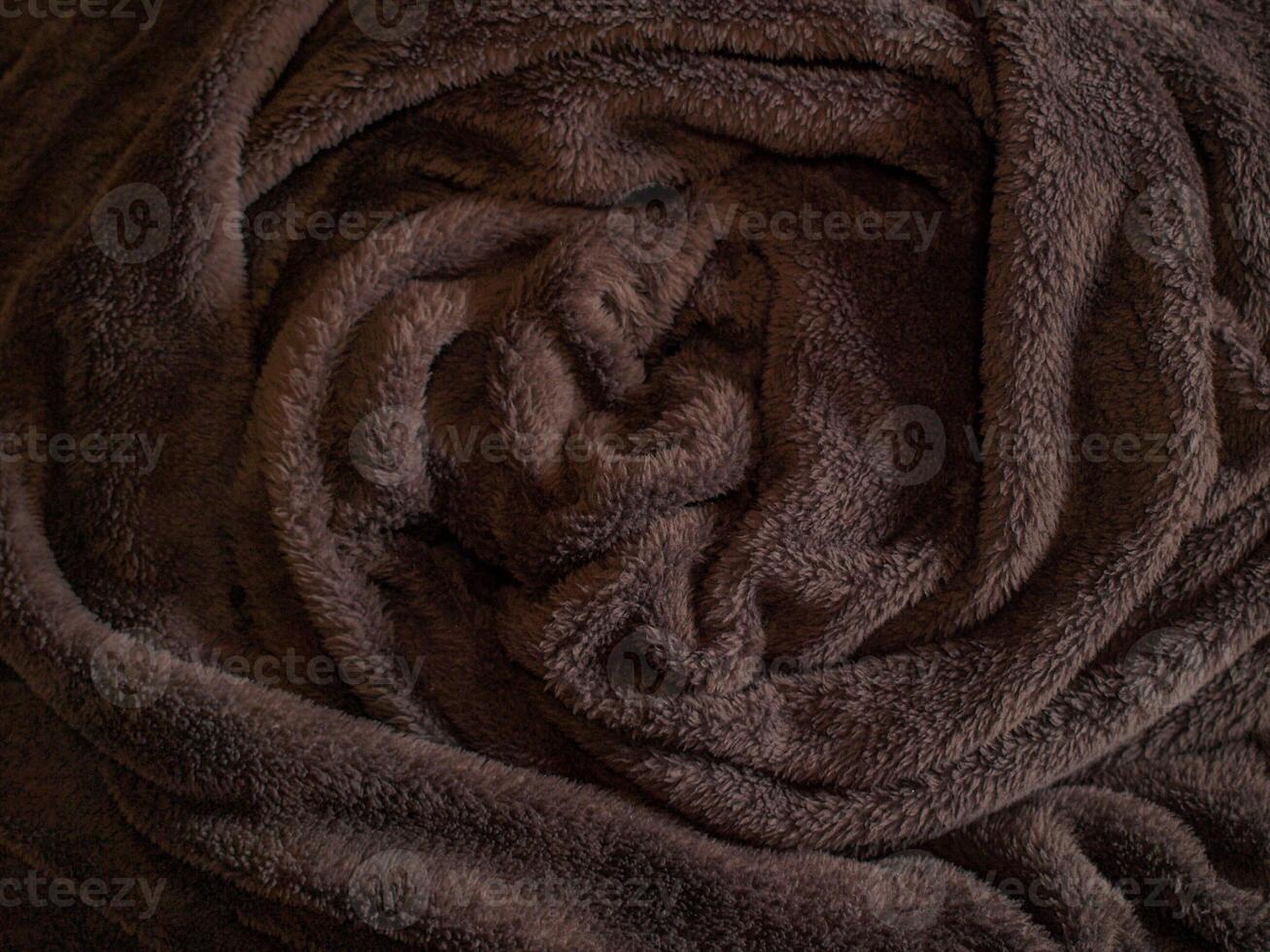 Luxurious Cozy Brown Fleece Blanket with Soft Texture and Warm Comfort for Relaxation at Home. Background, Texture photo