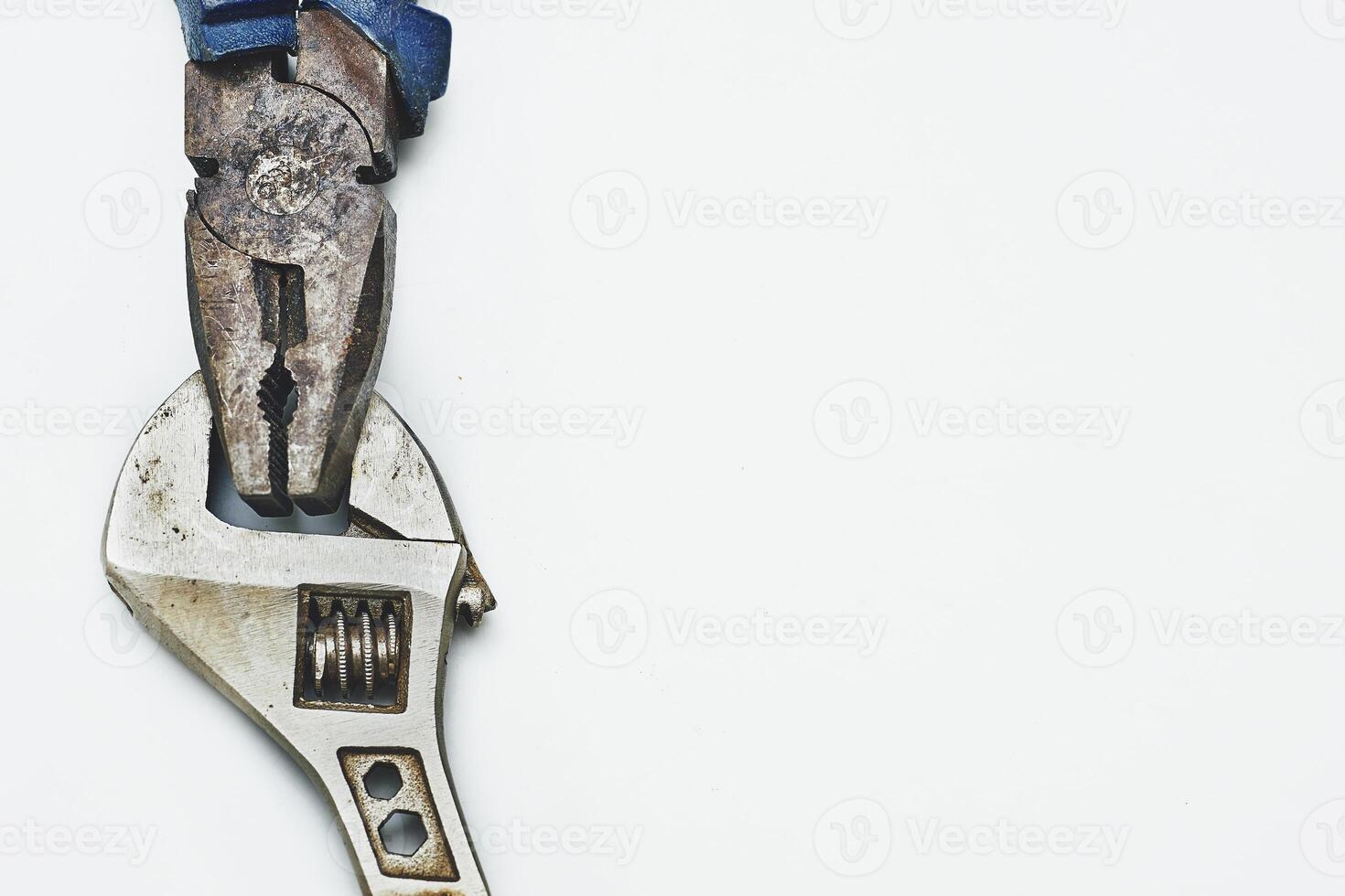 Old rusty pliers,adjustable wrench from the home shed for repair photo