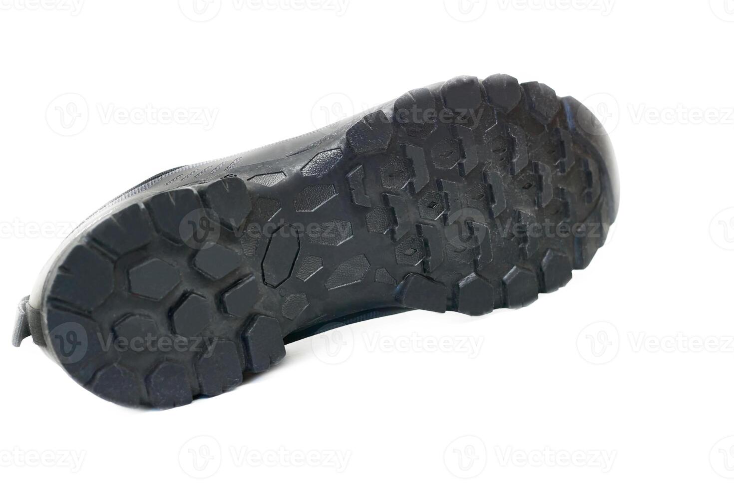 Sports trekking shoe with a powerful grooved sole photo