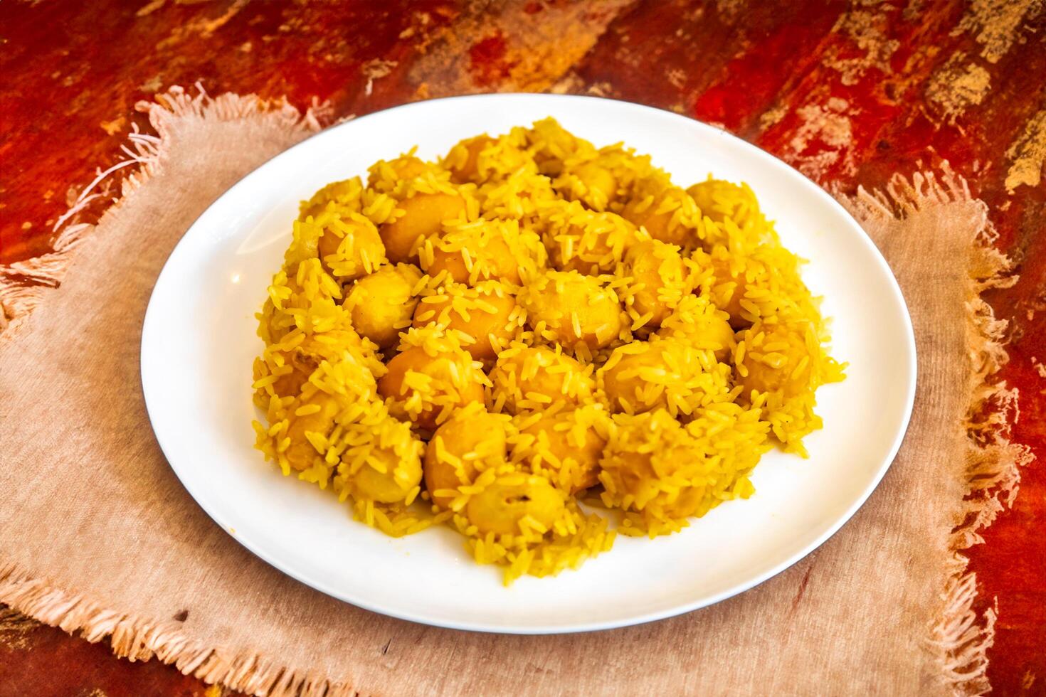 Traditional Brazilian dish chicken with pequi caryocar brasiliense and rice photo