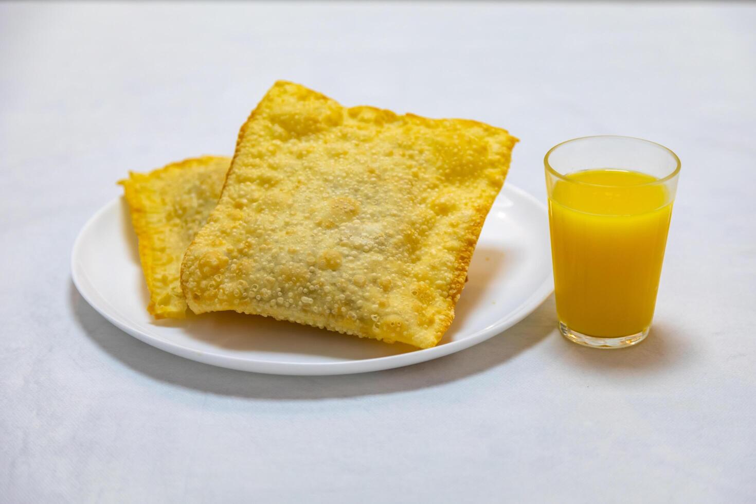 Traditional Brazilian fried pastry stuffed with ground beef. Pastel de feira. photo