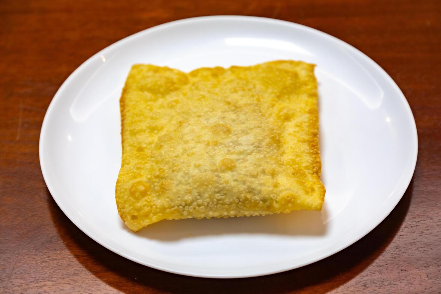 Traditional Brazilian fried pastry stuffed with ground beef. Pastel de feira. photo