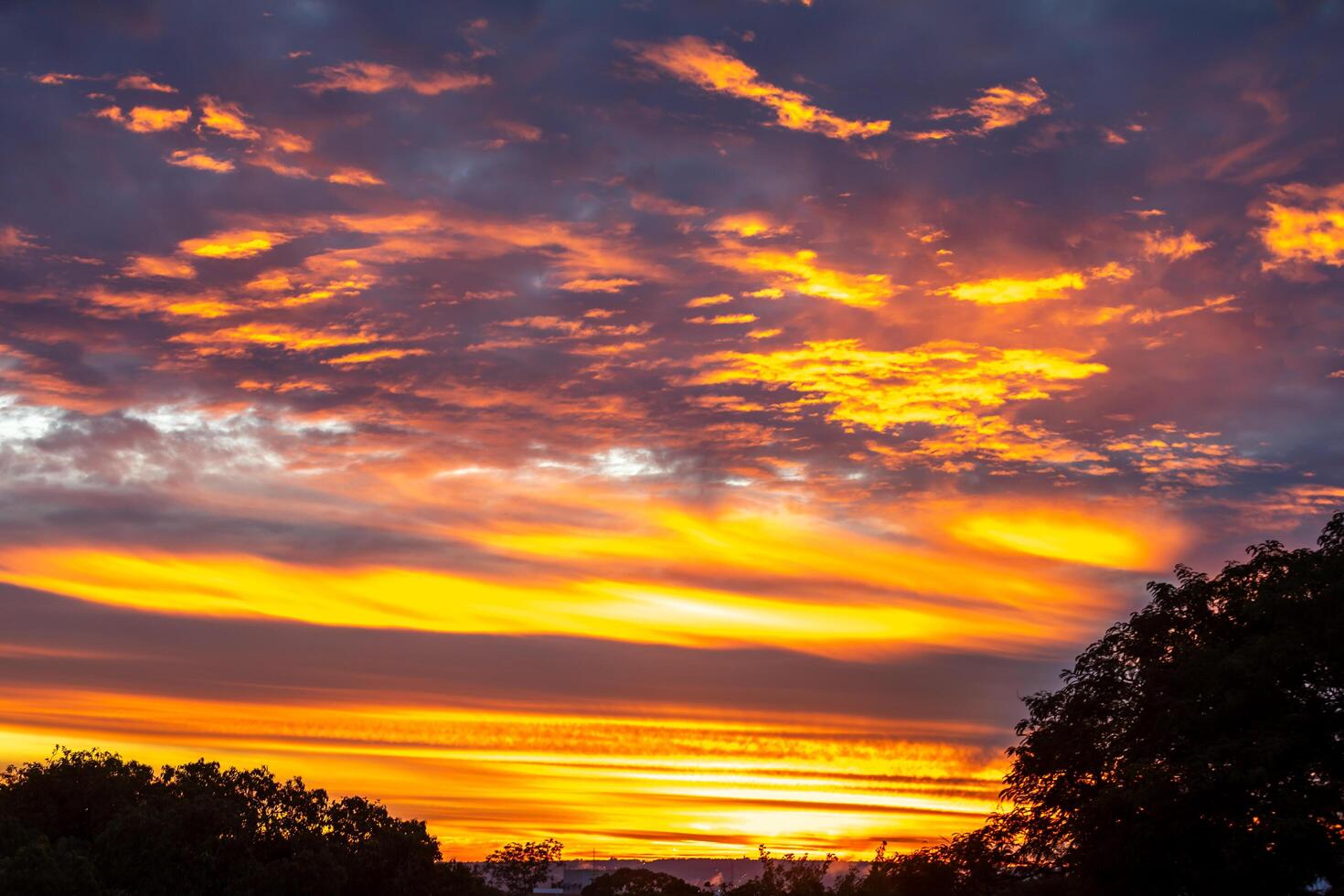 Sunrise with intense natural orange lights and idyllic dramatic scenery photo