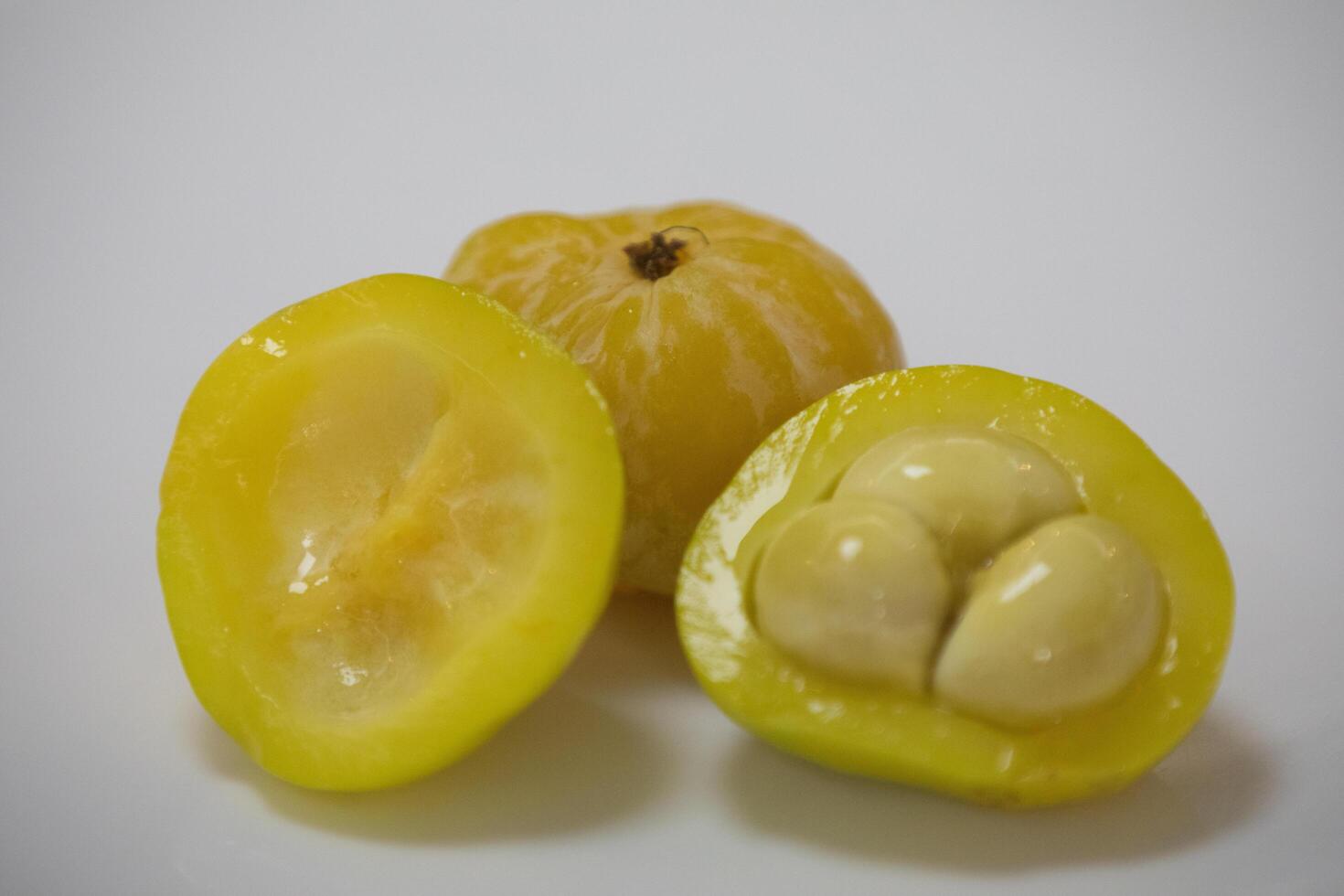 Ripe edible wild fruit from the Brazilian cerrado biome, fruit known as cagaita Stenocalyx dysentericus of the Magnoliopsida class and the Myrtaceae family. photo