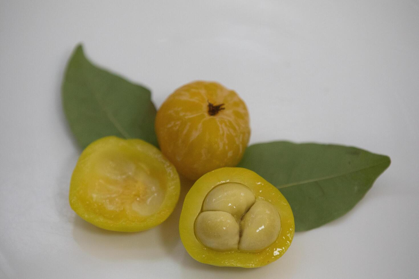 Ripe edible wild fruit from the Brazilian cerrado biome, fruit known as cagaita Stenocalyx dysentericus of the Magnoliopsida class and the Myrtaceae family. photo