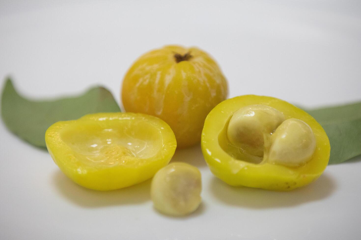 Ripe edible wild fruit from the Brazilian cerrado biome, fruit known as cagaita Stenocalyx dysentericus of the Magnoliopsida class and the Myrtaceae family. photo