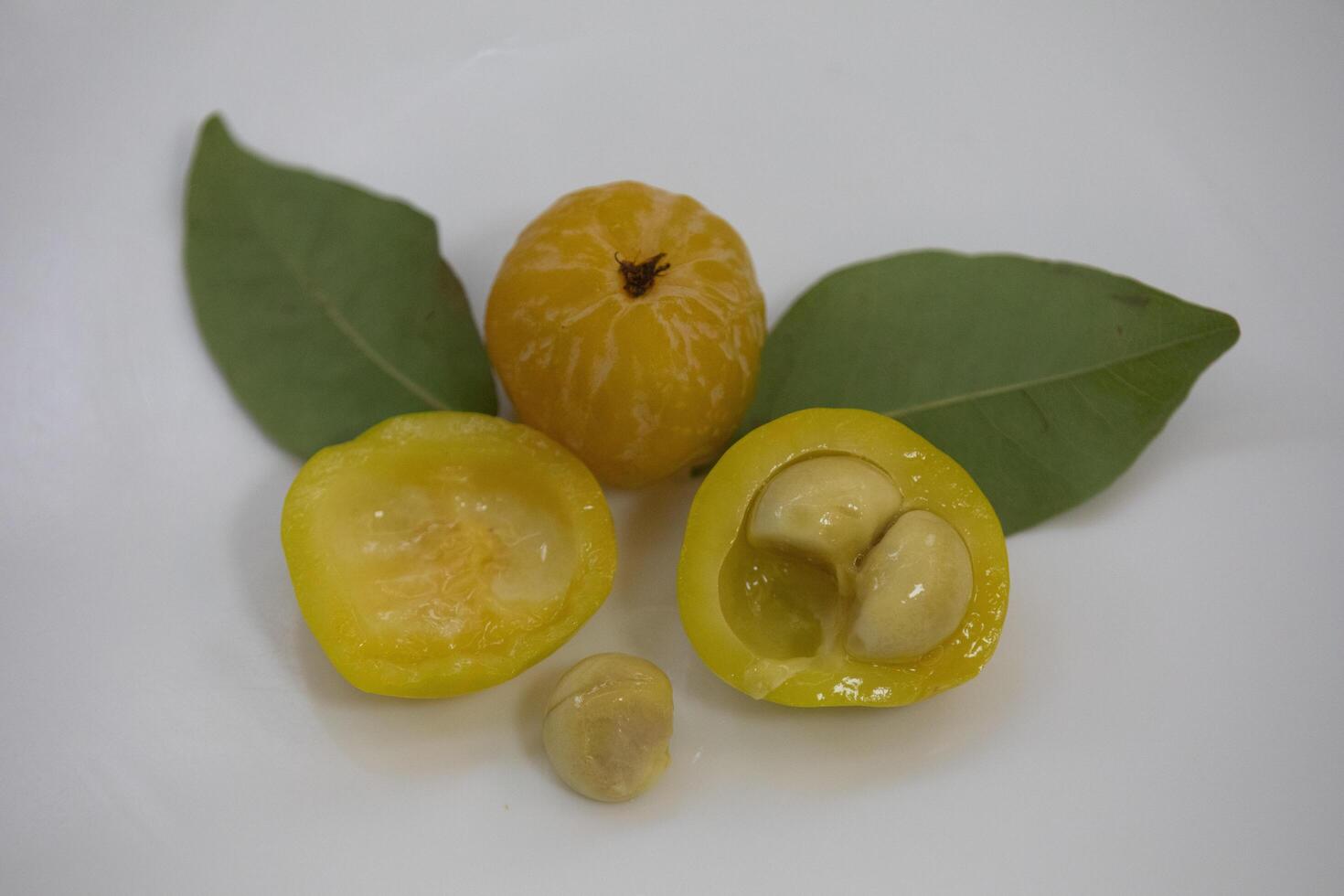 Ripe edible wild fruit from the Brazilian cerrado biome, fruit known as cagaita Stenocalyx dysentericus of the Magnoliopsida class and the Myrtaceae family. photo