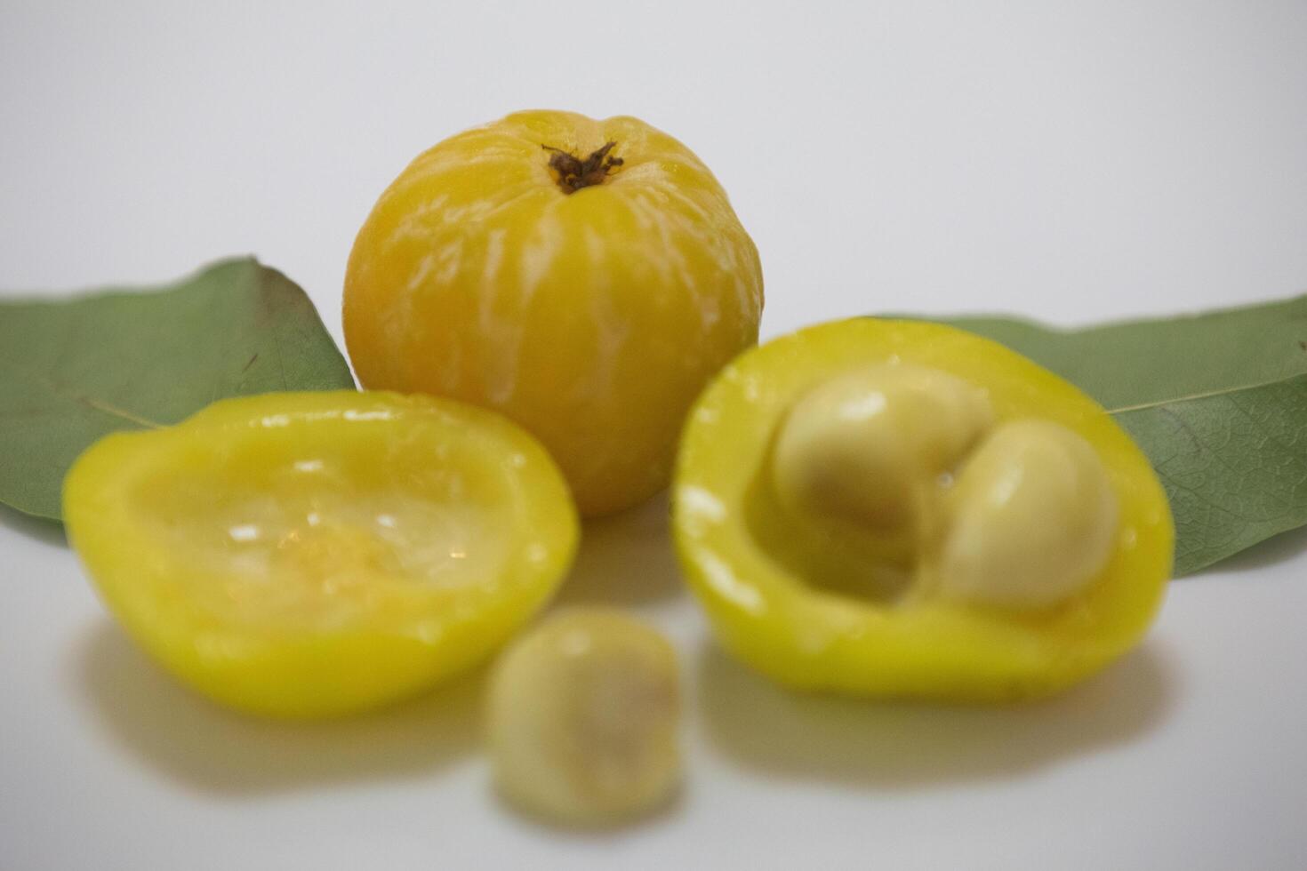 Ripe edible wild fruit from the Brazilian cerrado biome, fruit known as cagaita Stenocalyx dysentericus of the Magnoliopsida class and the Myrtaceae family. photo